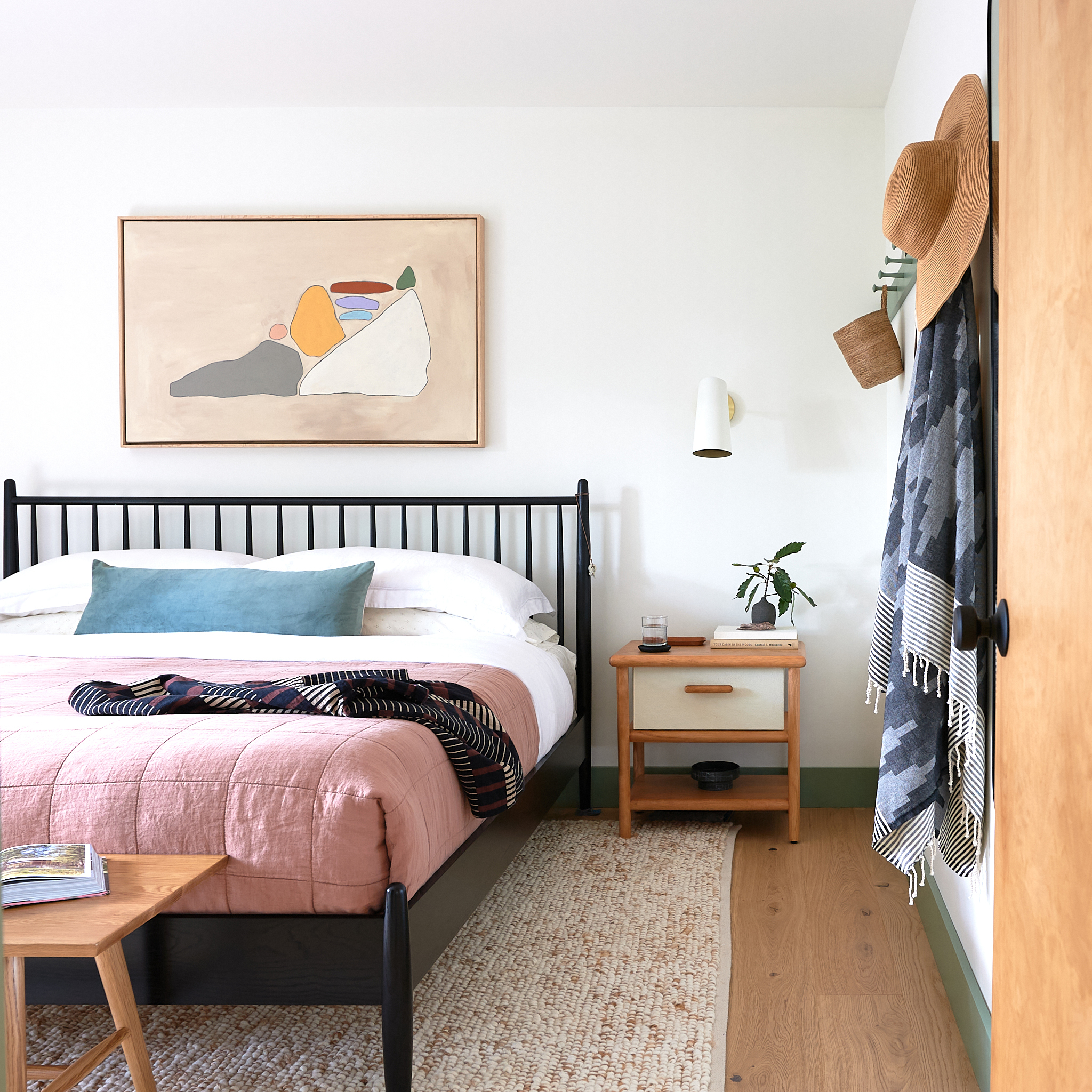 Modern Oak Floors, Spindle bed, and sconce over nightstand
