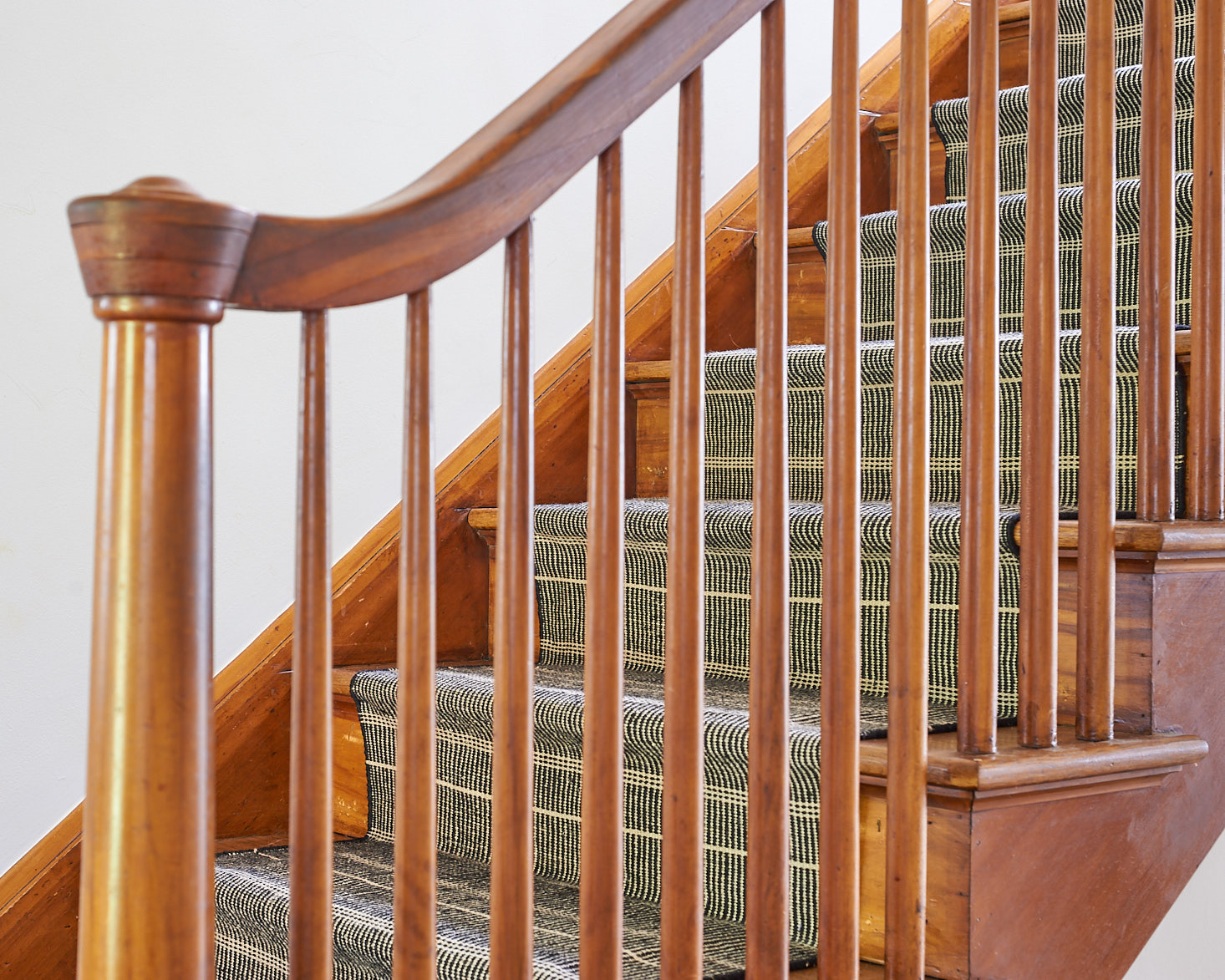 Detail of stair runner through spindles