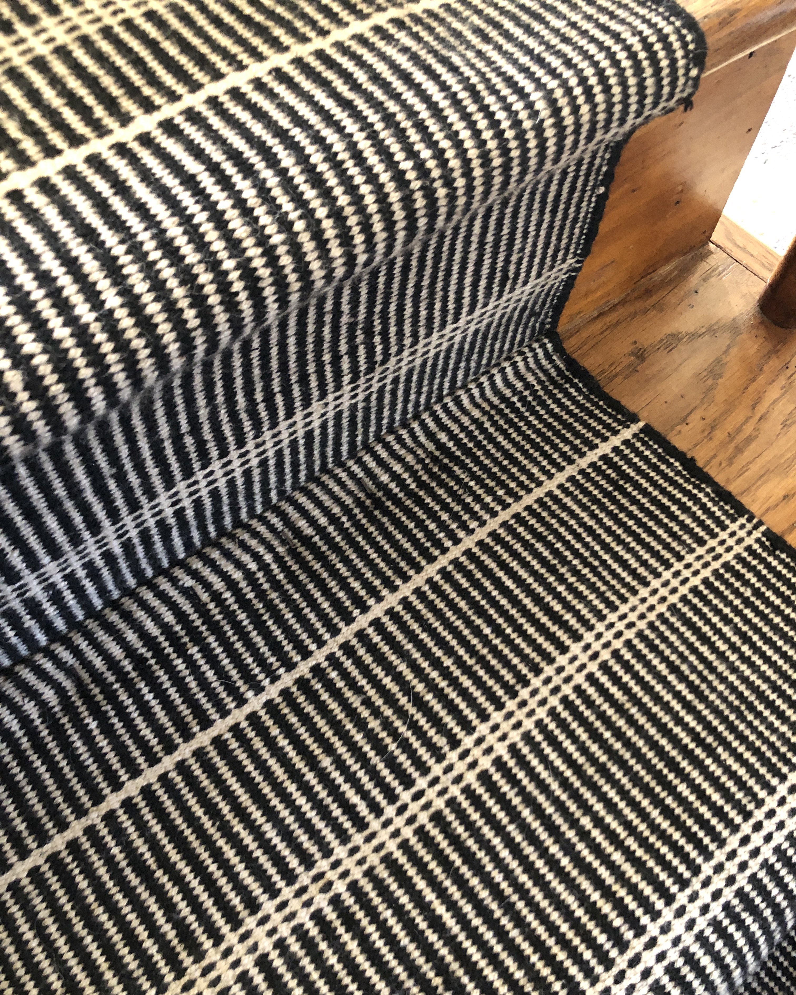 Detail of joined rugs on stairs
